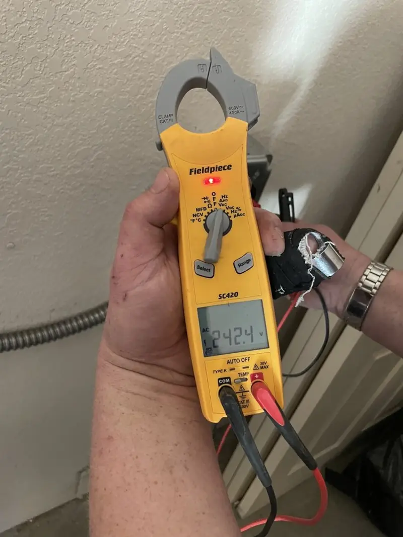 Voltage testing with clamp meter during Generator Installation in White
